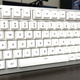 A completed GMMK Pro keyboard, silver, with frosty white keycaps.